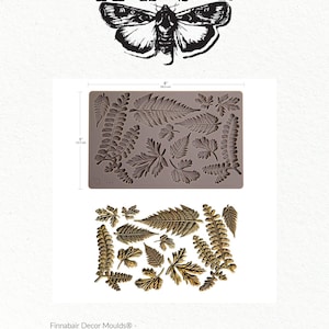 May include: A gray silicone mold with various leaf designs, measuring 8 inches by 5 inches. Below, a display of gold-colored leaf castings. The image includes the text "Finnabair" and "Fresh Foliage".