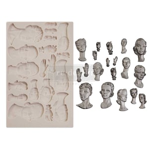Puede incluir: Un molde de silicona con 18 diseños diferentes de rostros y manos femeninas. El molde es gris claro y los diseños están en relieve. También hay 18 fundiciones metálicas individuales de los mismos diseños.