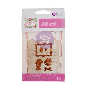 May include: A package of food-safe molds with various decorative designs, including a frame, leaves, a bust, a teacup, and a bow. The package is labeled "MOULDS" and measures 3.5" x 4.5".