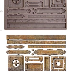 May include: A silicone mold with various vintage-style embellishments, including rulers, rectangular plaques, and square designs with cross and circle details. The mold is 5 inches (12.7 cm) tall and 120.3 cm wide.