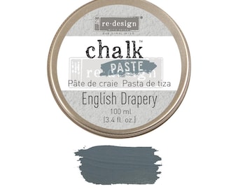 May include: A round tin of re-design chalk paste in the color English Drapery. The tin is silver with black text and a small paint swatch of the color. The text reads "re-design chalk paste" and "Pâte de craie Pasta de tiza". The tin also includes the size of the product, "100 ml (3.4 fl. oz.)".
