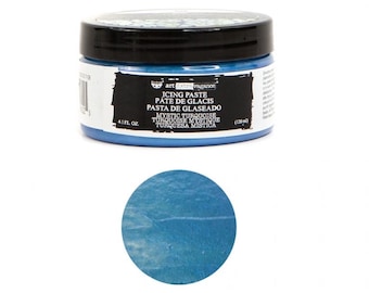 May include: A 4.1 fluid ounce jar of blue icing paste. The jar has a black lid and a white label with the text "art extravagance icing paste pate de glacis pasta de glaseado mystic turquoise turquoise mystique turquesa mistica 4.1 fl oz (120 ml)"