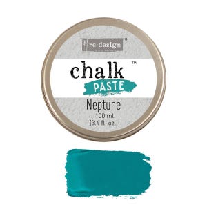 May include: A round, metallic tin of "chalk PASTE" in the color "Neptune". The label includes the text "re-design" and the volume, 3.4 fl. oz. Below the tin is a swatch of the teal-colored chalk paste.