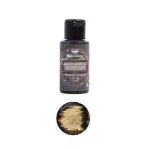 May include: A small bottle of Burnt Sienna liquid acrylic paint by Art Alchemy. The bottle is black with a silver label and a gold cap. The paint is a rich, earthy brown color.