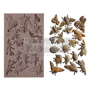 May include: A silicone mold with 18 different designs of bees and ladybugs. The mold is shown next to 18 finished resin castings of the same designs.
