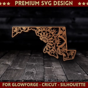 May include: A laser cut wooden design of the state of Maryland with a mandala pattern. The design is for use with Glowforge, Cricut, or Silhouette cutting machines.  "PREMIUM SVG DESIGN" is written at the top of the image.  "FOR GLOWFORGE - CRICUT - SILHOUETTE" is written at the bottom of the image.