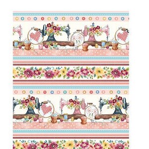 May include: A white fabric with a repeating pattern of sewing machines, flowers, and polka dots. The fabric is 16 inches wide and 42 inches long. The text "AS SHOWN 16" X 42" *stripe runs parallel to selvedge" is printed on the left side of the fabric.