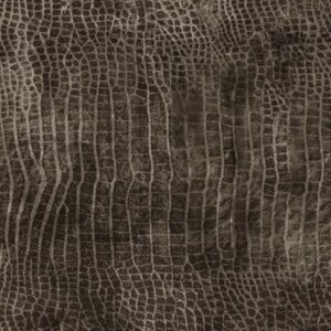 Può includere: Primo piano di un tessuto marrone testurizzato con un motivo a pelle di coccodrillo.