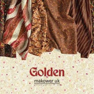 May include: A collection of patterned fabrics in shades of brown, red, and cream. The fabrics feature various designs, including geometric shapes, stripes, and floral patterns. The word "Golden" is displayed in red, along with "makower uk" and "Concord Fabrics UK Ltd."