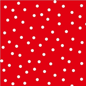 May include: A red background with a white polka dot pattern.