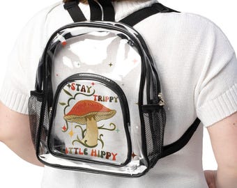 Mochila transparente aprobada para estadios, ideal para conciertos, festivales y días de partido. Correas negras de PVC. Diseño de setas.