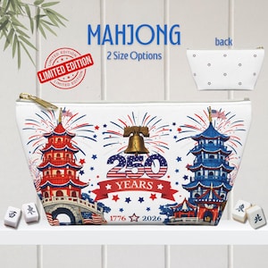 May include: White Mahjong pouch with a gold zipper, featuring a patriotic design with red, white, and blue pagodas, fireworks, and the Liberty Bell. The text reads "250 YEARS 1776 2026". Includes the text "MAHJONG" and "LIMITED EDITION".