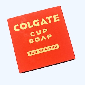 May include: Red box with gold lettering that reads "COLGATE CUP SOAP FOR SHAVING".