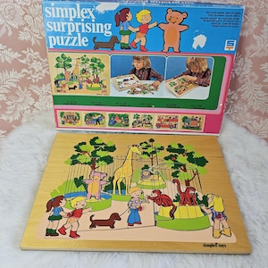 May include: A wooden zoo-themed puzzle featuring a giraffe, monkey, lion, and other animals. The puzzle is made by Simplex Toys and is suitable for ages 3-6 years. The box shows a colourful illustration of the puzzle pieces and the completed puzzle.