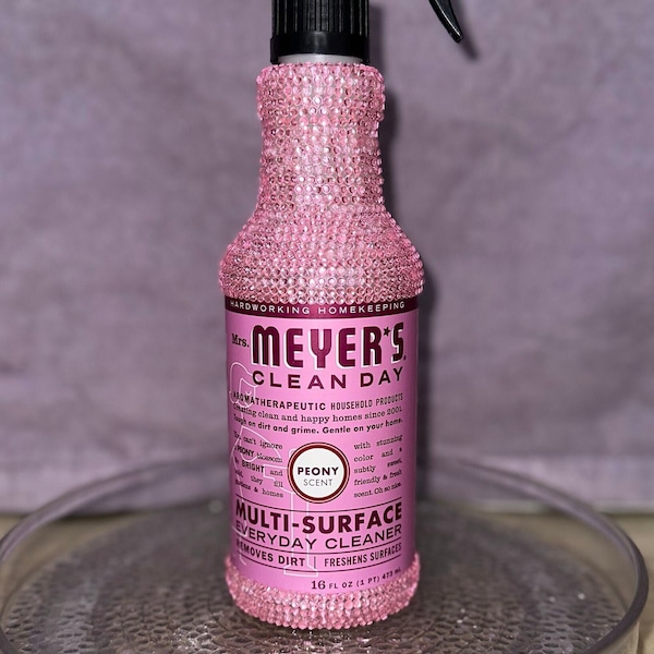 Pink bedazzled Meyers multi-surface cleaning spray (scent: peony)-filled with cleaner inside.