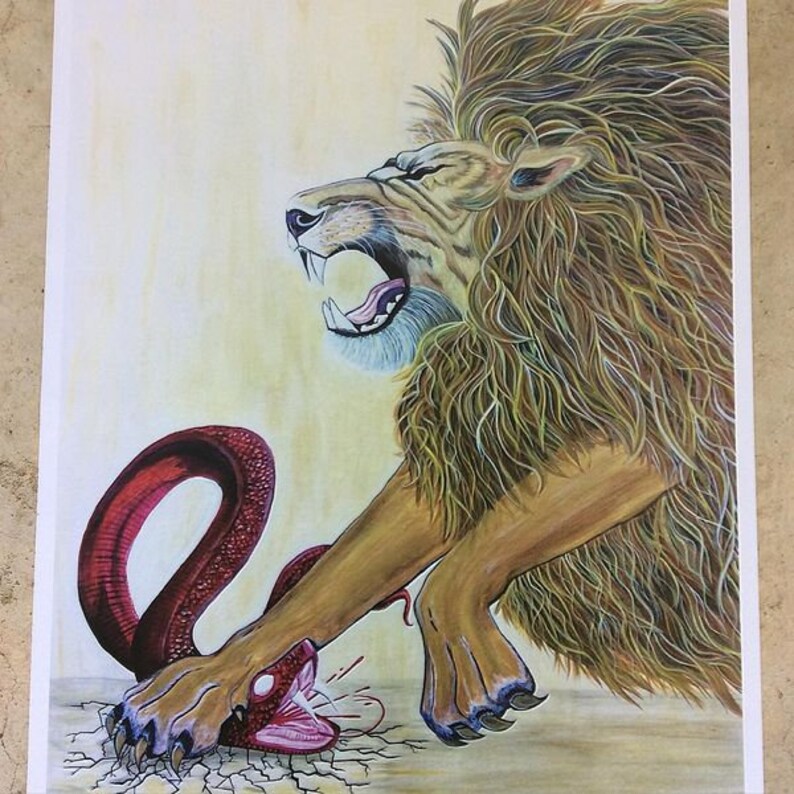 May include: A roaring lion with a thick mane of brown and gold fur is depicted in a watercolor painting. The lion is attacking a red snake with its claws. The snake is coiled around the lion's paw and has its mouth open in a defensive posture. The background is a light yellow color.