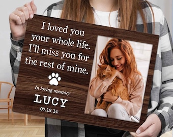 May include: A rectangular wooden memorial plaque featuring a dark wood grain finish. The text reads: I loved you your whole life. I'll miss you for the rest of mine. In loving memory LUCY 07.19.14. A white paw print icon and a photo of a person holding a cat.