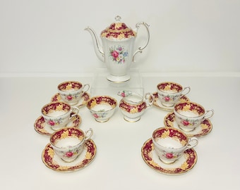 Paragon - Double Warrant, complete coffee set in pattern Y5287. Burgundy trim with pink cabbage rose & floral pattern