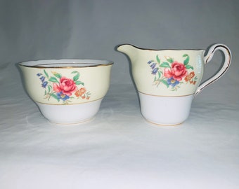 Colclough - yellow and floral sugar and creamer with pink cabbage rose.