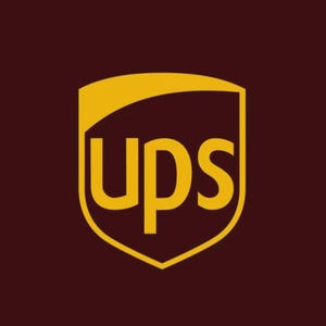 May include: The UPS logo features a gold shield shape with the letters "ups" in gold. The background is a dark brown color. The logo is a symbol of the United Parcel Service, a global package delivery company.