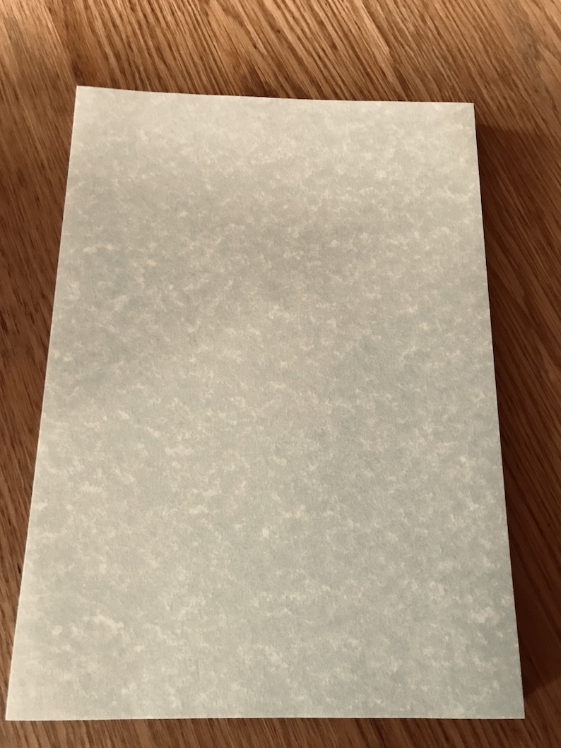 May include: A sheet of light blue paper with a textured surface.