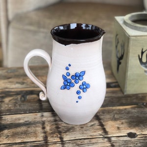 Vintage Pottery Pitcher: Handmade Ceramic Vase with Blue Floral Motif