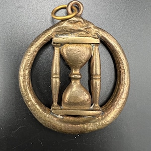 May include: A set of three ceramic mugs with a speckled, matte finish. The mugs are in shades of cream, light gray, and dark gray. Each mug has a simple, minimalist design and a rounded handle.