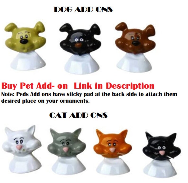 May include: A set of colorful, cartoon-style dog and cat ornaments. The ornaments are made of plastic and have a sticky pad on the back for attaching to surfaces. The text "DOG ADD ONS" and "CAT ADD ONS" is displayed above the ornaments.