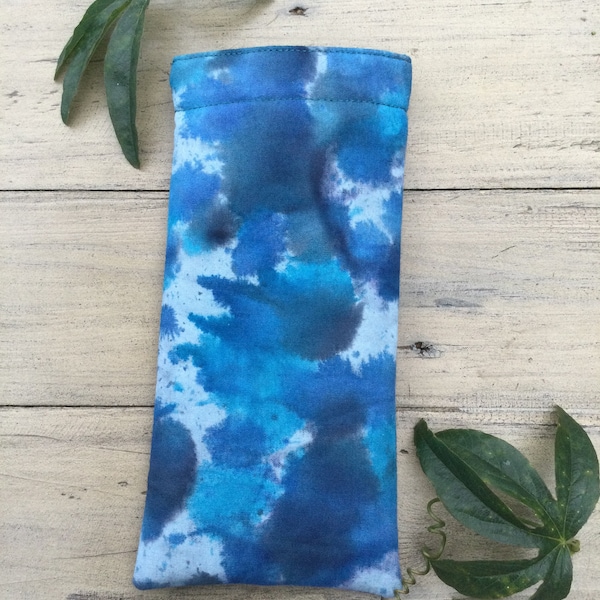 Glasses case batik cotton  in blues and greens and lined with Teal green poly cotton lining . Wadding  and  magnetic popper to close.