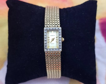 Gorgeous Ladies' Geneve wristwatch, 14K yellow gold with diamonds.