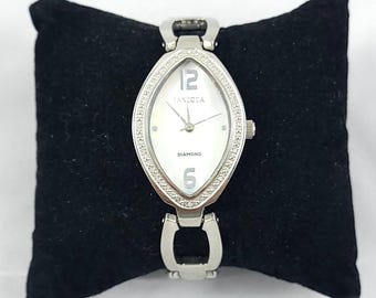 Invicta Wildflower diamond accent watch with a mother-of-pearl dial.