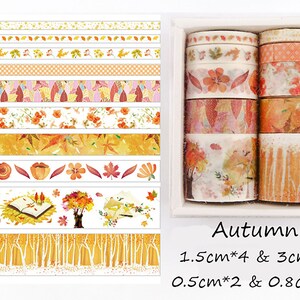 May include: A set of 10 washi tapes with autumn-themed designs. The tapes feature various patterns, including leaves, flowers, trees, and a book. The tapes are in a variety of colors, including orange, yellow, brown, and white. The tapes are packaged in a clear plastic box with the text "Autumn" and the measurements "1.5cm*4 & 3cm*2 0.5cm*2 & 0.8cm*2".