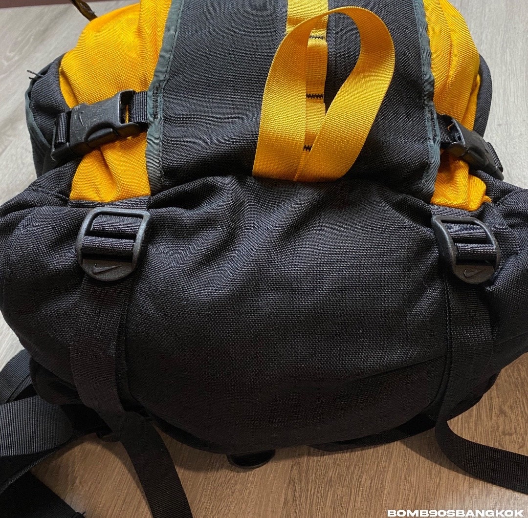 yellow and black nike backpack