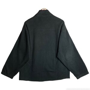 May include: A black fleece jacket with a zip fastening and a stand-up collar.