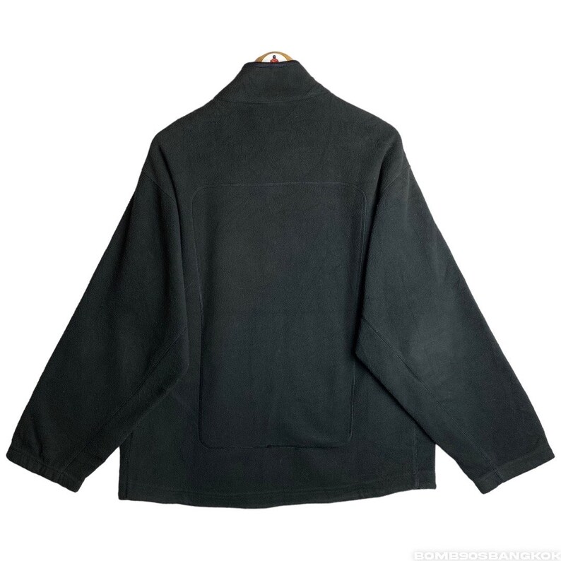 May include: A black fleece jacket with a zip fastening and a stand-up collar.