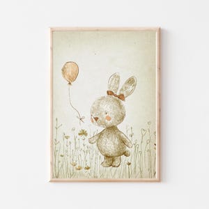 May include: A brown bunny with a pink bow holding a peach-colored balloon in a field of green grass with yellow flowers.