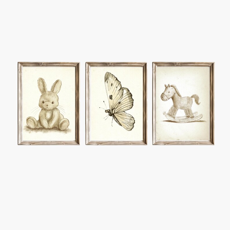 May include: Set of three framed prints featuring a brown bunny, a butterfly, and a rocking horse. The prints are in a rustic style with a white background and brown accents.