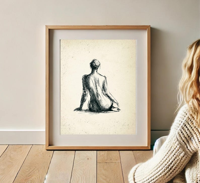 May include: A black and white line drawing of a person sitting with their back to the viewer. The drawing is on a cream-colored background.