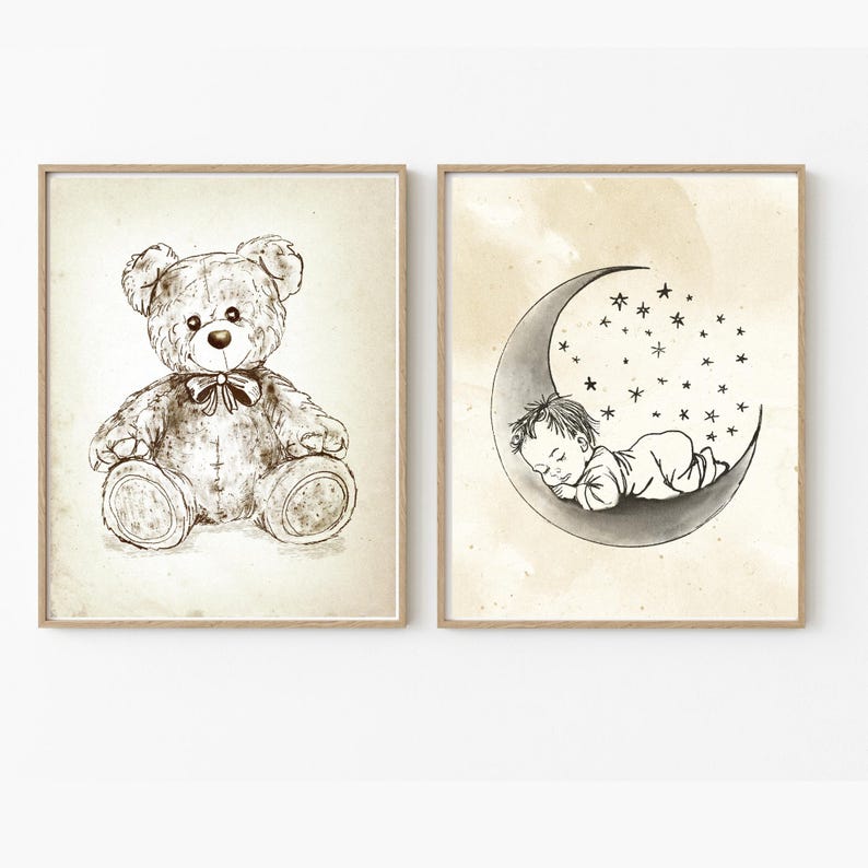 May include: Two black and white illustrations in frames. The first illustration shows a teddy bear sitting with a bow tie. The second illustration shows a baby sleeping in a crescent moon with stars.