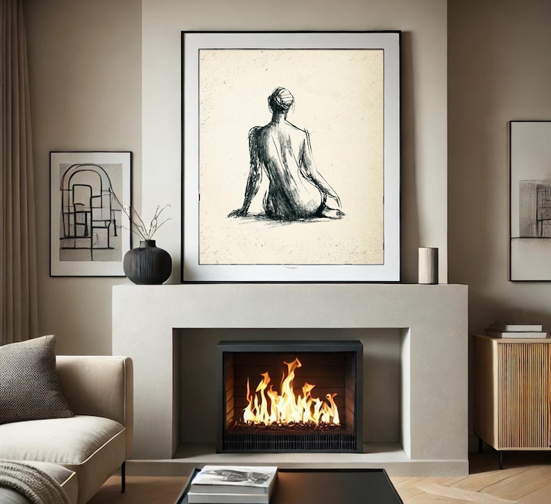 May include: A black and white sketch of a person sitting with their back to the viewer, framed and hanging above a fireplace with a fire burning inside.