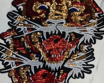 Tigre de lentejuelas de ojos azules