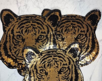 Tigre de lentejuelas doradas