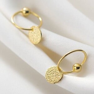 Dainty gold plated huggies with hammered plate detail