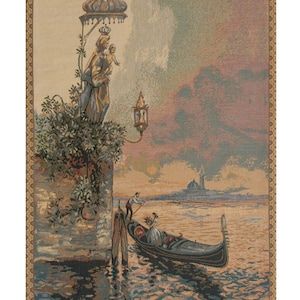 May include: A tapestry depicting a scene in Venice, Italy. A gondola with two people is in the foreground, with a statue of the Virgin Mary and child in the background. The sky is a soft pink and blue, and the water is a deep blue.
