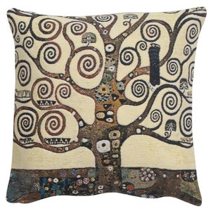 May include: A decorative throw pillow featuring a tapestry design of a stylized tree with swirling branches and a bird perched on a branch. The background is a cream color, and the tree is a mix of brown, black, and gold colors.