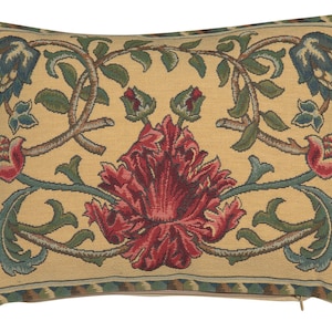 May include: Rectangular decorative pillow with a floral tapestry design. The pillow features a central red flower with green leaves and blue-green accents on a beige background. The border has a patterned trim.