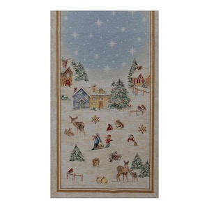 May include: A rectangular Christmas-themed tapestry featuring a winter village scene. The design includes snow-covered houses, evergreen trees, deer, and figures sledding. The background is a light blue sky with stars, framed by a beige border.