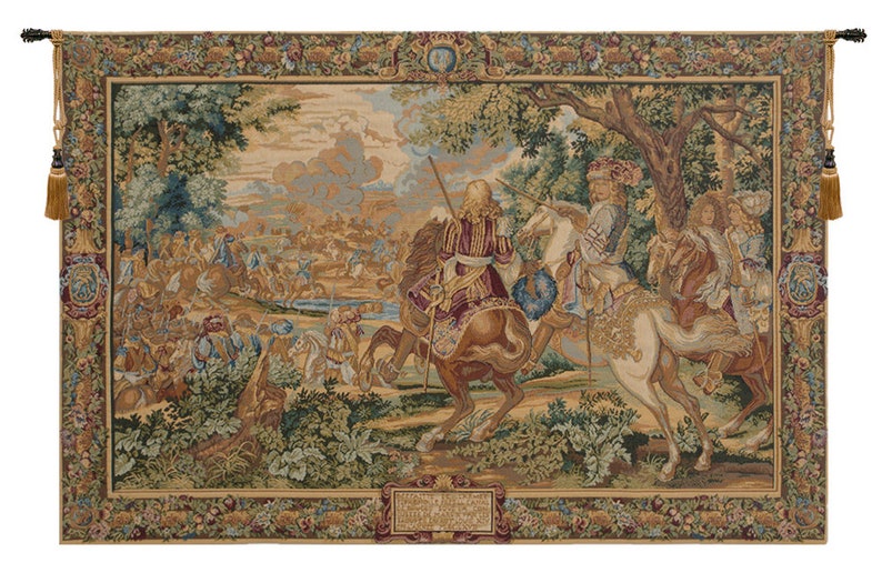 May include: A tapestry depicting a scene of horseback riding in a forest. The tapestry features a group of people on horseback, with a large group of people in the background. The tapestry is framed with a decorative border.