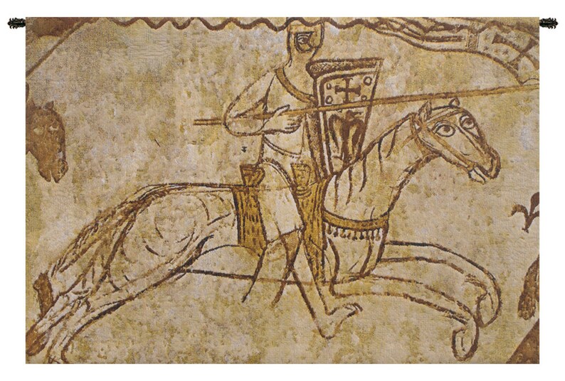 May include: A tapestry depicting a medieval knight on horseback, holding a spear and shield. The knight is wearing armor and a helmet, and the horse is adorned with a saddle and bridle. The tapestry is made of woven fabric and has a brown and beige color scheme.