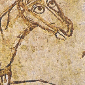 May include: A close-up of a brown and beige tapestry with a woven image of a horse's head. The horse's eye is detailed with a brown circle and a white dot.